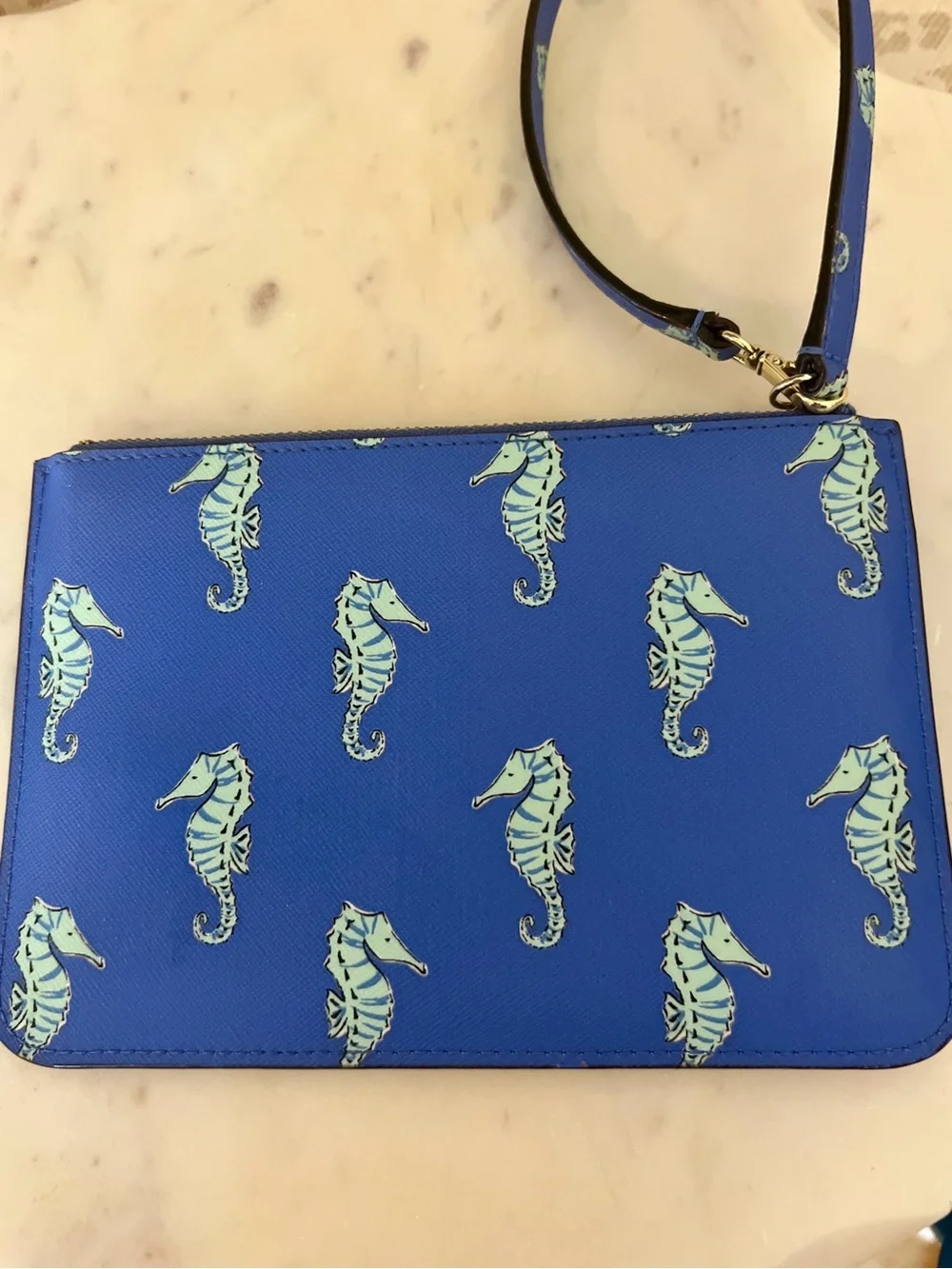 kate spade cobalt blue seahorse wristlet clutch